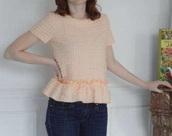 Pink ruffled cotton smocked top