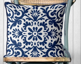 May include: A blue and white patterned throw pillow with a floral design. The pillow is sitting on a wooden chair with a blue metal frame.