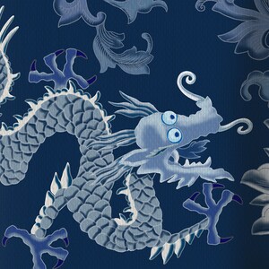 May include: A blue and white dragon design on a dark blue background. The dragon is curled up with its head facing the right side of the image. The dragon has large eyes and a long snout.