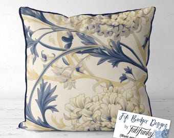 May include: A cream-colored pillow with a navy blue and gold floral pattern. The pillow has a navy blue border. The text "Fifi Badger Designs by Fabifunky" is on a white tag in the bottom right corner of the image.
