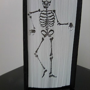 Skeleton cut and fold book fold pattern