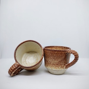 Handmade biscuit coloured ceramic cups
