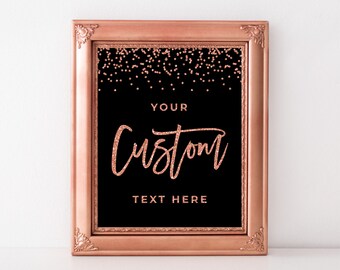 May include: A framed sign with a black background and rose gold glitter accents. The sign reads "YOUR CUSTOM TEXT HERE" in rose gold script. The frame is a matching rose gold color with ornate corners.