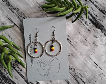 Aboriginal designed circle red yellow black earrings