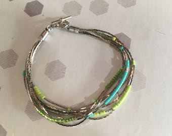 the bracelet 8 strands and these blue and green beads
