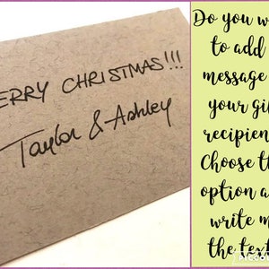 May include: A brown paper envelope with the handwritten message "MERRY CHRISTMAS!!! Taylor & Ashley". The text "Do you want to add a message to your gift recipient? Choose this option and write me the text!" is written in black on a yellow background.