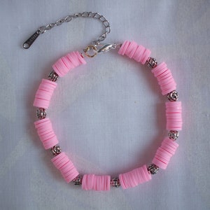 Wristband made up with pink heishi and silver metal beads