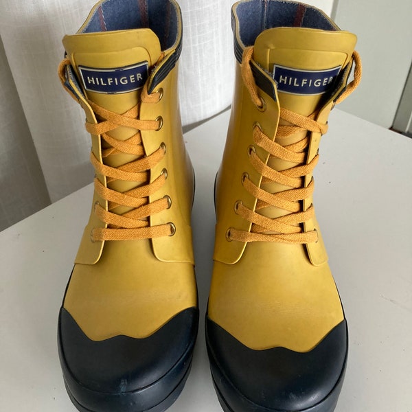 Tommy Hilfiger rain boots.  Cute yellow and black boots.  They read size 7.  I wear a 7 1/2 to 8 and they fit me fine.  Pre-worn.