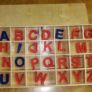 Montessori movable alphabet. Wooden movable alphabet with felt letters.