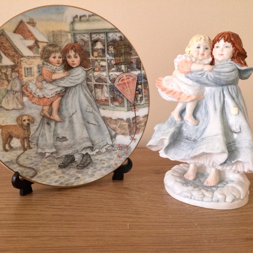 Royal Worcester shops figurine. “ Love” and The NSPCC Christmas Plate “ Love”. 1987