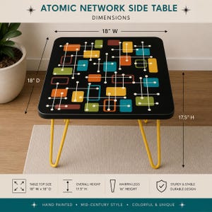 May include: Atomic Network Side Table with a black top featuring a colorful geometric pattern of orange, yellow, green, and teal rectangles connected by white lines. The table has yellow hairpin legs and measures 18 inches wide, 18 inches deep, and 17.5 inches high.