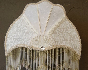 Victorian lamp Aurore, crescent moon shape with beaded fringe for small space.