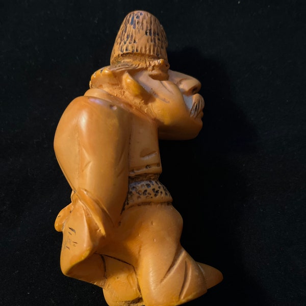 Egg yolk Bakelite figurine, man with tarboosh