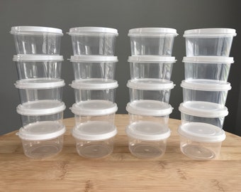 Recipientes de plástico redondos de 2 oz con tapa
