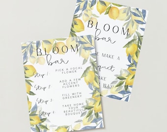 以下が含まれることがあります： レモンと花のデザインが施された2つの看板。上の看板には「BLOOM bar」と書いてあり、下の看板には「BLOOM bar」と書いてあり、ブーケの作り方の説明が書かれています。「ステップ1：中心となる花を選びます」「ステップ2：アクセントとなる花をいくつか加えます」「ステップ3：緑で満たします」「ステップ4：美しいブーケを持ち帰りましょう」。