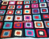 Plaid, blanket, short hand-knitted tip in mohair and wool on black background