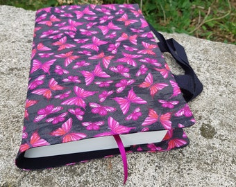 Fabric book cover with pink butterflies on a dark gray and black background