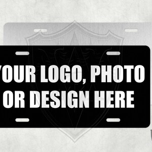 May include: Black metal license plate with white text that reads "Your logo, photo or design here".