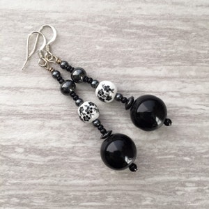 Long black beaded dangle earrings bohem style jewelry black and white with hematite beads and floral accents