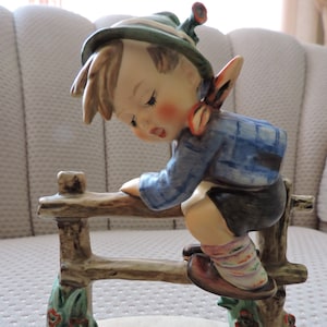 Hummel boy on fence with frog clearance