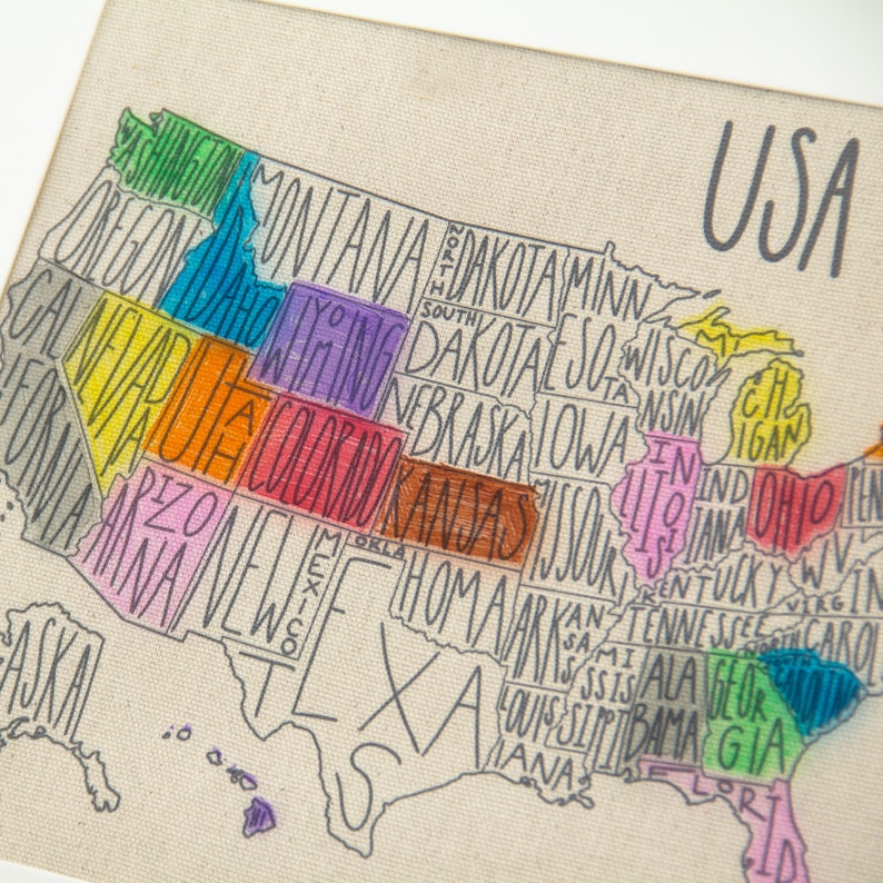 May include: A hand-drawn map of the United States with each state outlined in a different color. The states are labeled with their names in a handwritten font. The map is on a beige canvas background.