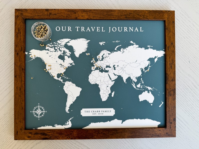 World map framed and ready to hang. Track your adventures with push pins.
