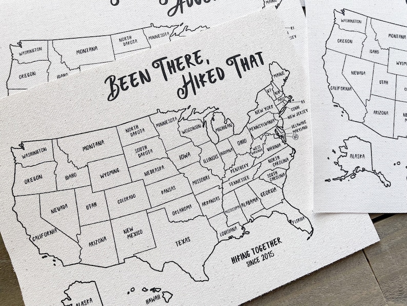 May include: A black and white outline map of the United States with the text "Been There, Hiked That" and "Hiking Together Since 2015" printed on the map.