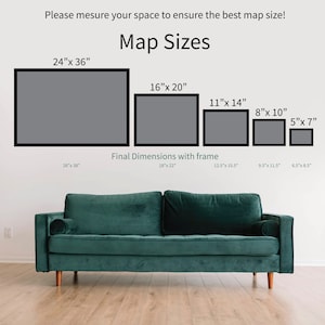 May include: A white wall with a couch in front of it. The wall has a chart with different sizes of framed maps. The chart is titled "Map Sizes". The sizes of the maps are listed in inches. The final dimensions with frame are also listed in inches.