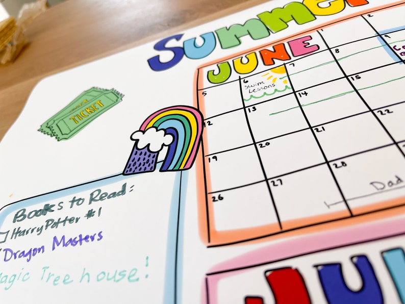 May include: A colorful summer calendar with the month of June highlighted. The calendar has a rainbow, a ticket, and a list of books to read, including "Harry Potter #1", "Dragon Masters", and "Magic Tree House!"