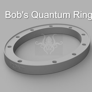 May include: A gray plastic ring with a raised edge and eight holes around the perimeter. The word "FRONT" is embossed on the ring.