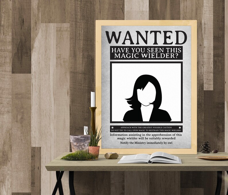 May include: A black and white wanted poster with the text "WANTED HAVE YOU SEEN THIS MAGIC WIELDER?" and a silhouette of a woman with long hair. The poster also includes the text "APPROACH WITH THE GREATEST POSSIBLE CAUTION DO NOT TRY TO CALL UPON MAGIC TO RESTRAIN THIS MAGIC WIELDER: Information assisting in the apprehension of this magic wielder will be suitably rewarded Notify the Ministry immediately by owl"