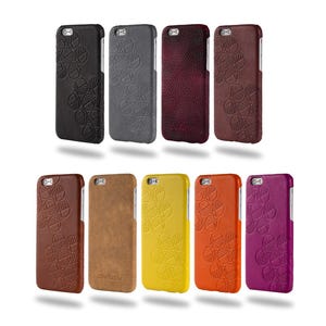 May include: A collection of ten phone cases in various colors, including black, gray, burgundy, brown, tan, yellow, orange, and purple. Each case features a floral pattern and is designed to fit a smartphone. The brand name "Drew Lennox" is visible on one case.