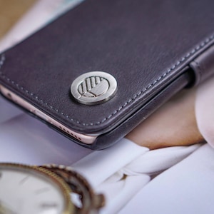 May include: A set of three ceramic nesting bowls in graduating sizes. The bowls feature a speckled, off-white glaze with a slightly textured surface. The largest bowl measures approximately 8 inches in diameter.