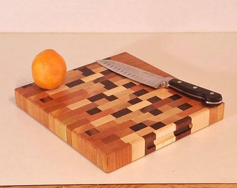 Abstract end grain cutting board, 12 x 11 hardwood chopping block, random pattern color decor, confusing design, checkered face, cubed angle