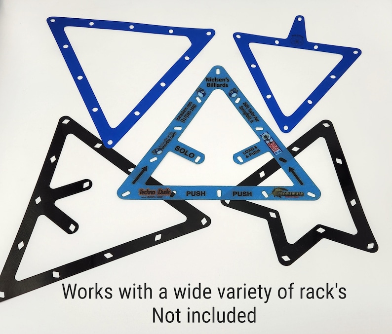 May include: A collection of five triangular billiard ball racks in blue and black. The central blue rack features text including Nielsen's Billiards, Solo, Load & Push, and Techno Duds. Below the racks, the text reads: Works with a wide variety of rack's Not included.