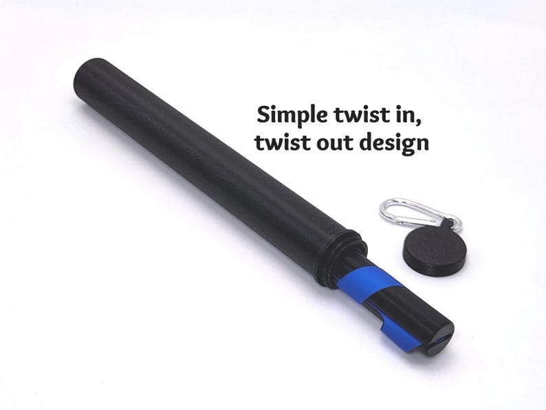 May include: A black cylindrical tube with a blue internal component, featuring a separate black circular cap with a silver carabiner. The text "Simple twist in, twist out design" is printed in black next to the tube on a white background.