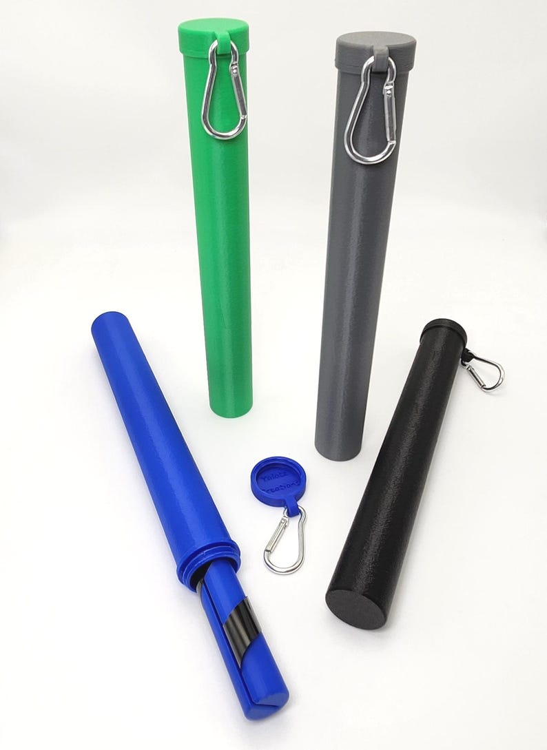 May include: Four cylindrical storage tubes in green, gray, blue, and black, each featuring a matching cap and a silver metal carabiner attached to the top. A small blue circular tag with a silver carabiner is positioned in the center.