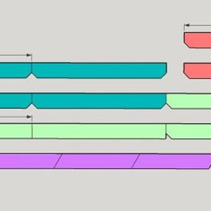 May include: Diagram showing how to cut wood strips to create a colorful geometric pattern. The strips are in various colors, including teal, green, purple, and orange. The diagram includes measurements in inches.