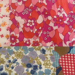 May include: A patchwork of floral fabric samples in various patterns and colours. The top row features a white fabric with pink and orange flowers, a vibrant pink and orange floral design, and a dark floral print. The bottom row includes blue and purple floral patterns and a red gingham pattern.