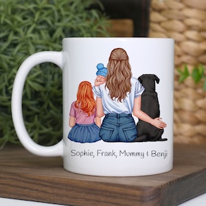 May include: White ceramic mug featuring a colourful illustration of a woman with two children and a dog. The text "Sophie, Frank, Mummy & Benji" is printed on the mug.