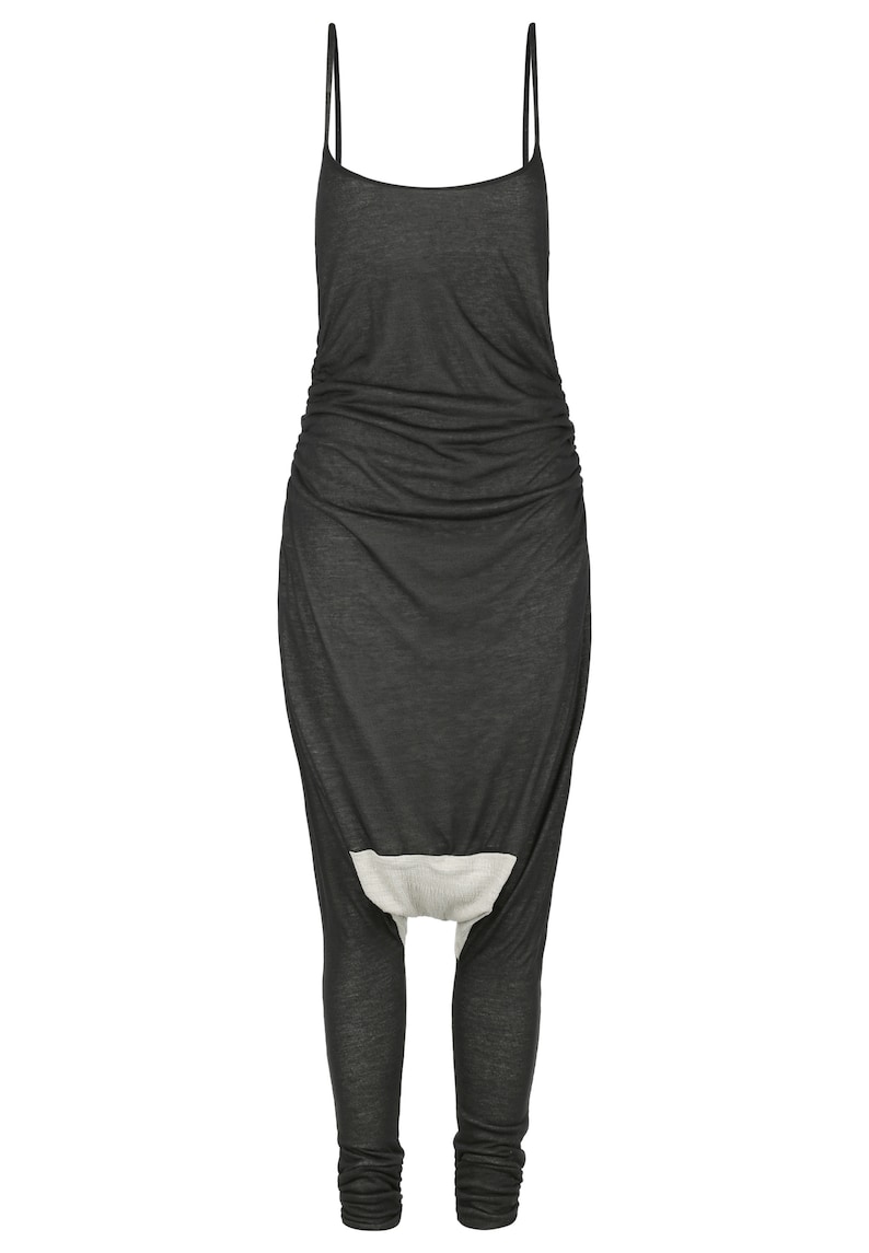 May include: A black sleeveless jumpsuit with a gathered waist and a white panel at the crotch.