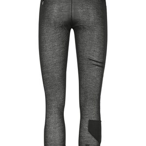 May include: Black leggings with a textured, slightly sheer fabric. The leggings have a high waistband and a small logo on the left hip.