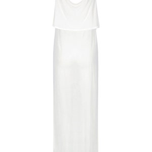 May include: A white sleeveless maxi dress with a layered, draped neckline.