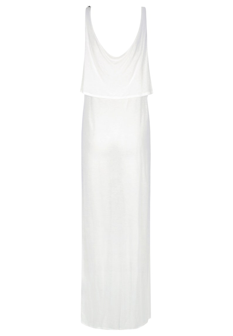 May include: A white sleeveless maxi dress with a layered, draped neckline.