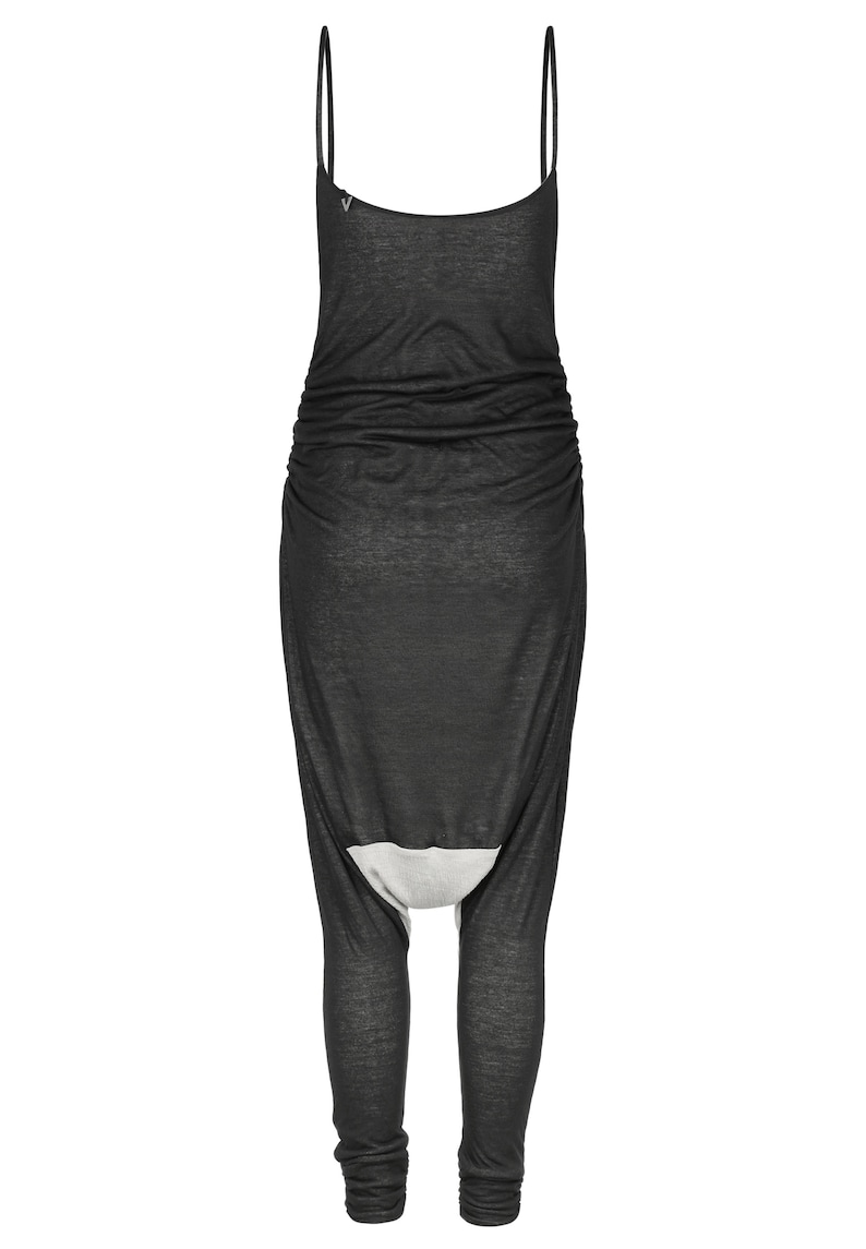 May include: Black sleeveless jumpsuit with a gathered waist and a unique leg design. The jumpsuit is made of a soft, stretchy fabric.