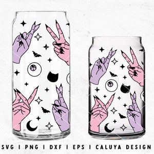 May include: Two clear glass tumblers with a white background and a repeating pattern of pink and purple hands making peace signs, black bats, black eyes, black cats, and black crescent moons.  The tumblers are perfect for Halloween parties or everyday use.