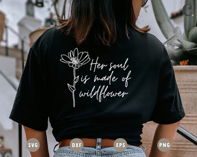 May include: Black t-shirt with a white outline of a flower and the text "Her soul is made of wildflower".