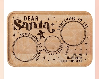 May include: A wooden cutting board with the text "Dear Santa" and three circles for "Something to Eat", "Something to Drink", and "Rudolph's Carrot". The text "PS, We Have Been Good This Year" is also included.