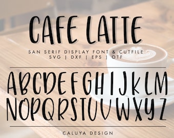May include: Cafe Latte font in black, a sans serif display font, with uppercase letters A through Z. The font is shown on a woodgrain background with a cup of coffee with latte art.
