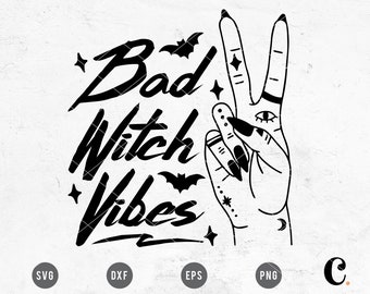 May include: Black and white graphic design featuring a hand making the peace sign with various tattoos, including a crescent moon, stars, and an eye. The text "Bad Witch Vibes" is written in a stylised font with bats and stars.